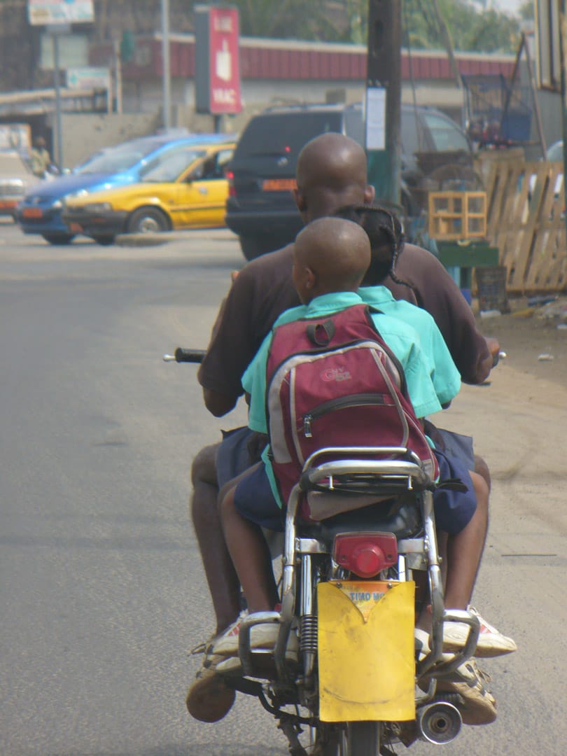 Father and 3 kids on motorcycle